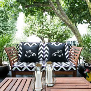 Inspiration for a small contemporary metal railing balcony with a potted garden and no cover.