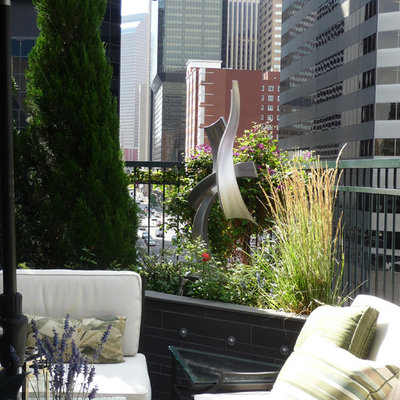 Example of a small trendy metal railing balcony container garden design in Denver