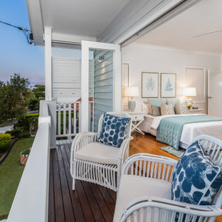 This is an example of a large beach style balcony in Brisbane with a roof extension.