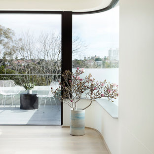 Photo of a modern balcony in Sydney with glass railing.