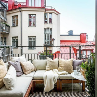Immagine di un balcone scandinavo di medie dimensioni con nessuna copertura e un giardino in vaso