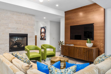 Mid-century modern wood wall living room photo in Denver with white walls, a standard fireplace and a stone fireplace