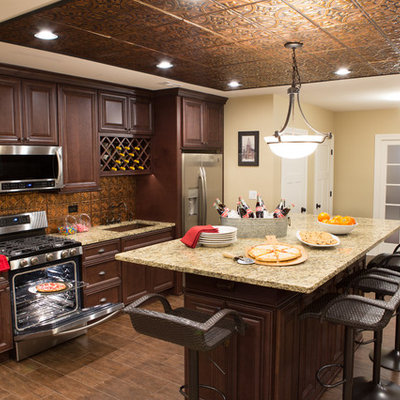 Basement - large traditional underground dark wood floor and brown floor basement idea in Chicago with beige walls, a standard fireplace and a stone fireplace