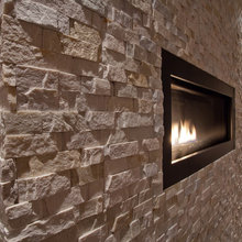contemporary fireplace/stone wall