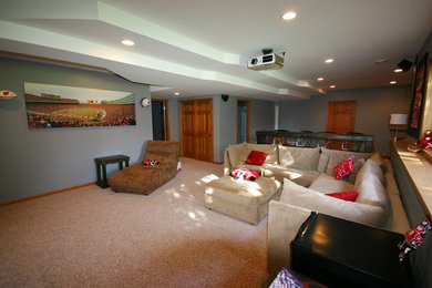 Example of a mid-sized classic underground carpeted basement design in Milwaukee with blue walls and no fireplace