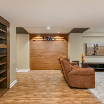 Basement home theater with closed hidden bookcase
