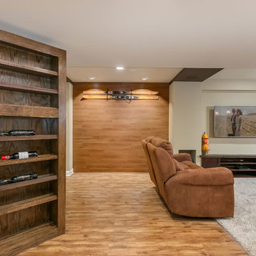 Basement home theater with open hidden bookcase