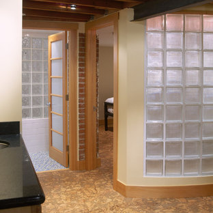 Example of a small trendy underground cork floor basement design in Denver