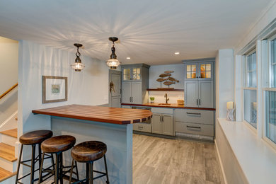 Mid-sized beach style porcelain tile and gray floor home bar photo in Boston