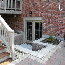 Exterior rear- basement door and balcony