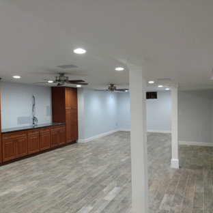 75 Beautiful Porcelain Tile Basement with a Corner Fireplace Pictures ...
