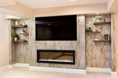 Photo of a medium sized classic fully buried basement in New York with beige walls, carpet, a hanging fireplace and beige floors.