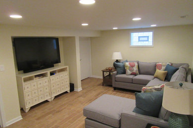 Example of a small minimalist underground porcelain tile and brown floor basement design in Chicago with yellow walls