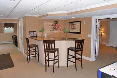 Inspiration for a large basement in Boston with beige walls.
