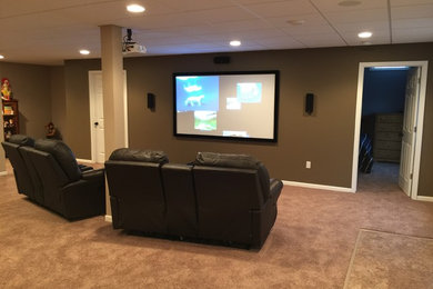 Home theater - contemporary home theater idea in Detroit
