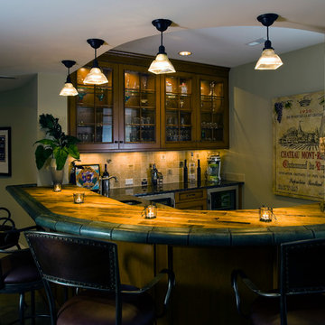 Basement Wet Bar with Glass Panel Cabinets and Wine Barrel Countertop