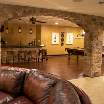 Basement with Curved Bar and Entertainment Areas