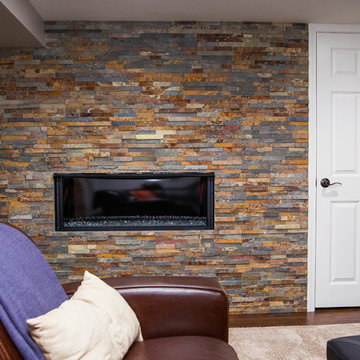 Basement with Stone Fireplace and Half Bathroom