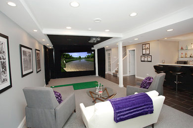 Example of a mid-sized underground carpeted and multicolored floor basement design in Minneapolis with gray walls and no fireplace