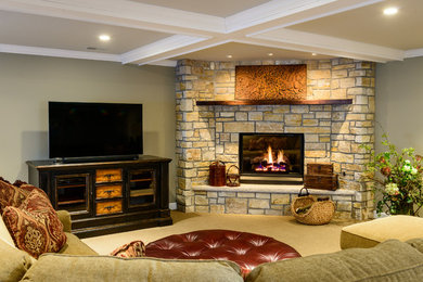 Basement - mid-sized rustic look-out carpeted basement idea in Chicago with brown walls, a standard fireplace and a stone fireplace