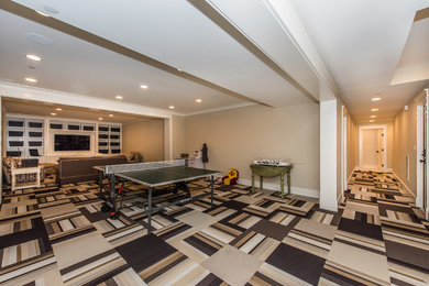 Example of a carpeted basement design in Baltimore with beige walls
