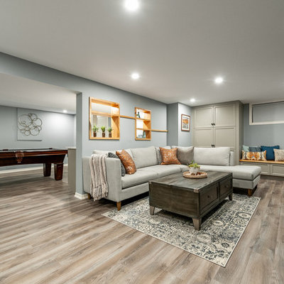 Basement - small craftsman look-out laminate floor and gray floor basement idea in Ottawa with blue walls and no fireplace