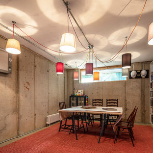 Photo of an urban basement in Oxfordshire with concrete flooring, grey walls and grey floors.