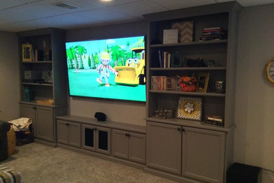Inspiration for a carpeted basement remodel in Detroit with beige walls