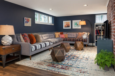 Example of a transitional look-out vinyl floor and brown floor basement design in Seattle with blue walls and no fireplace