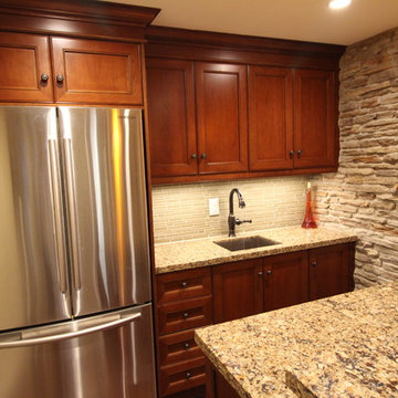 Built in cabinetry, Cambria Canterbury countertops and stone wall