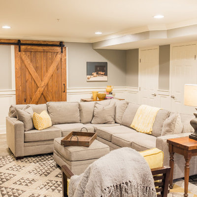 Mid-sized country walk-out porcelain tile basement photo in Baltimore with gray walls