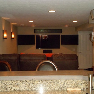 Basement - small modern underground carpeted basement idea in Indianapolis with beige walls