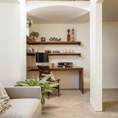 Mid-sized mid-century modern underground concrete floor and gray floor basement photo in Boston with gray walls