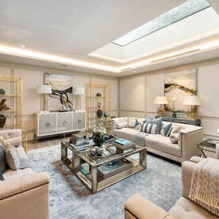 Inspiration for a medium sized traditional fully buried basement in London with beige walls.