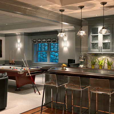 Example of a classic look-out carpeted basement design in Boston with gray walls and no fireplace