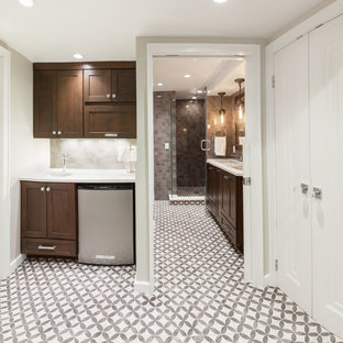 Inspiration for a large transitional underground concrete floor and gray floor basement remodel in Milwaukee with beige walls