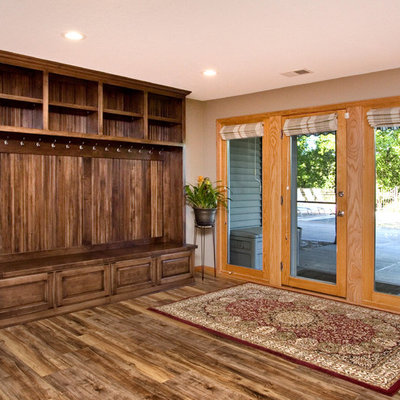 Inspiration for a mid-sized timeless look-out medium tone wood floor basement remodel in Minneapolis with beige walls and no fireplace