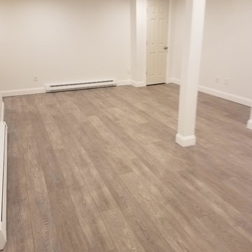 COREtec Wide Plank Vinyl Flooring over a concrete slab in Basement