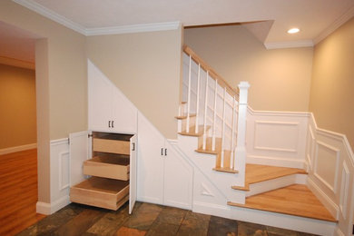 Traditional staircase in Boston with under stair storage.