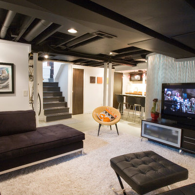 Example of an urban underground white floor basement design in Cincinnati with white walls