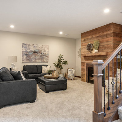 Large transitional look-out carpeted and white floor basement photo in Minneapolis with gray walls, a standard fireplace and a brick fireplace
