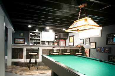 Example of an arts and crafts basement design in Other