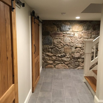 Farmhouse basement with handmade barn doors.