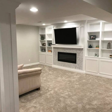 Finished basement in Galena area w electric fireplace, custom built in cabinets