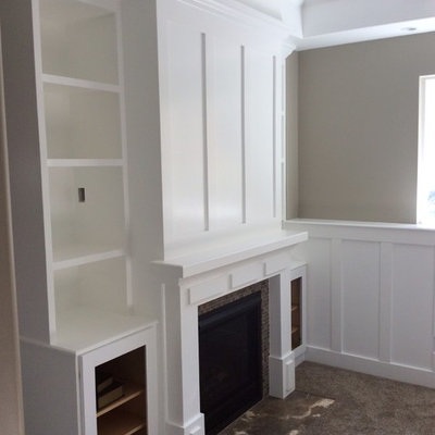 Example of a mid-sized classic look-out carpeted and brown floor basement design in Salt Lake City with beige walls and a standard fireplace
