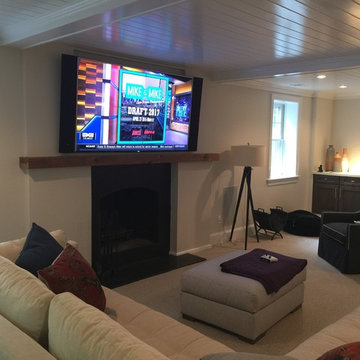 Full Basement Renovation - 75" 4K TV over fireplace with Artison Speakers