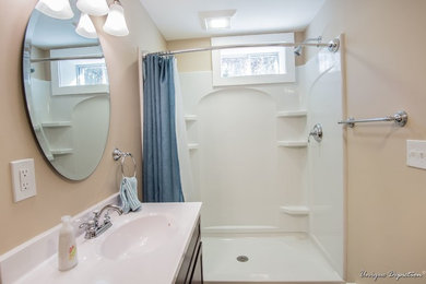This is an example of a small modern bathroom in Boston with beige walls.