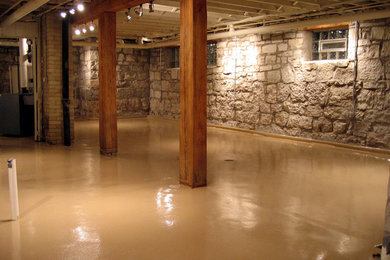 Basement - mid-sized rustic look-out concrete floor and brown floor basement idea in Philadelphia with no fireplace and multicolored walls
