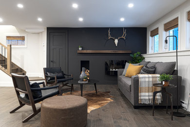 Example of a mid-sized trendy walk-out dark wood floor basement design in Other with multicolored walls