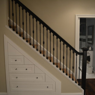 Example of a large transitional underground dark wood floor and brown floor basement design in Philadelphia with gray walls